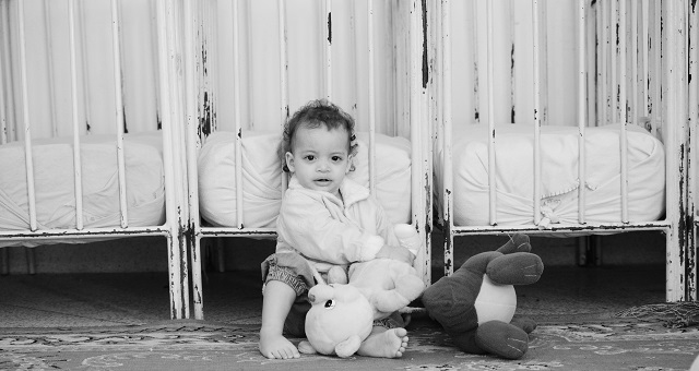 Girl plays with soft toys donated by some aid that arrived during my visit