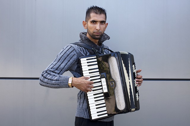 St Georges Cross, gold watch with Accordion © Mahtab Hussain - The Commonality of Strangers 2014